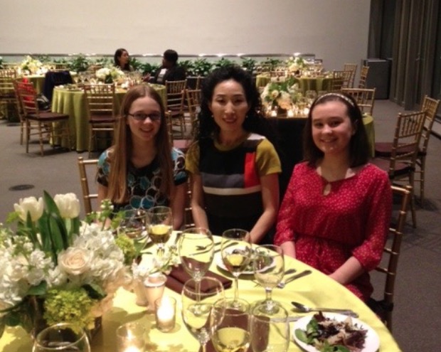 Miyoung Dempsey with students in a celebration event